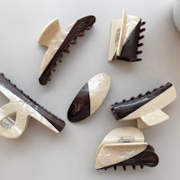 a group of brown and white hair clips laying on a table